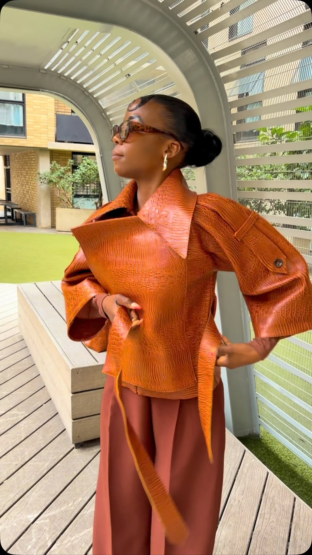 Elan By Kristen — cognac textured faux leather jacket styled with wide-leg trousers