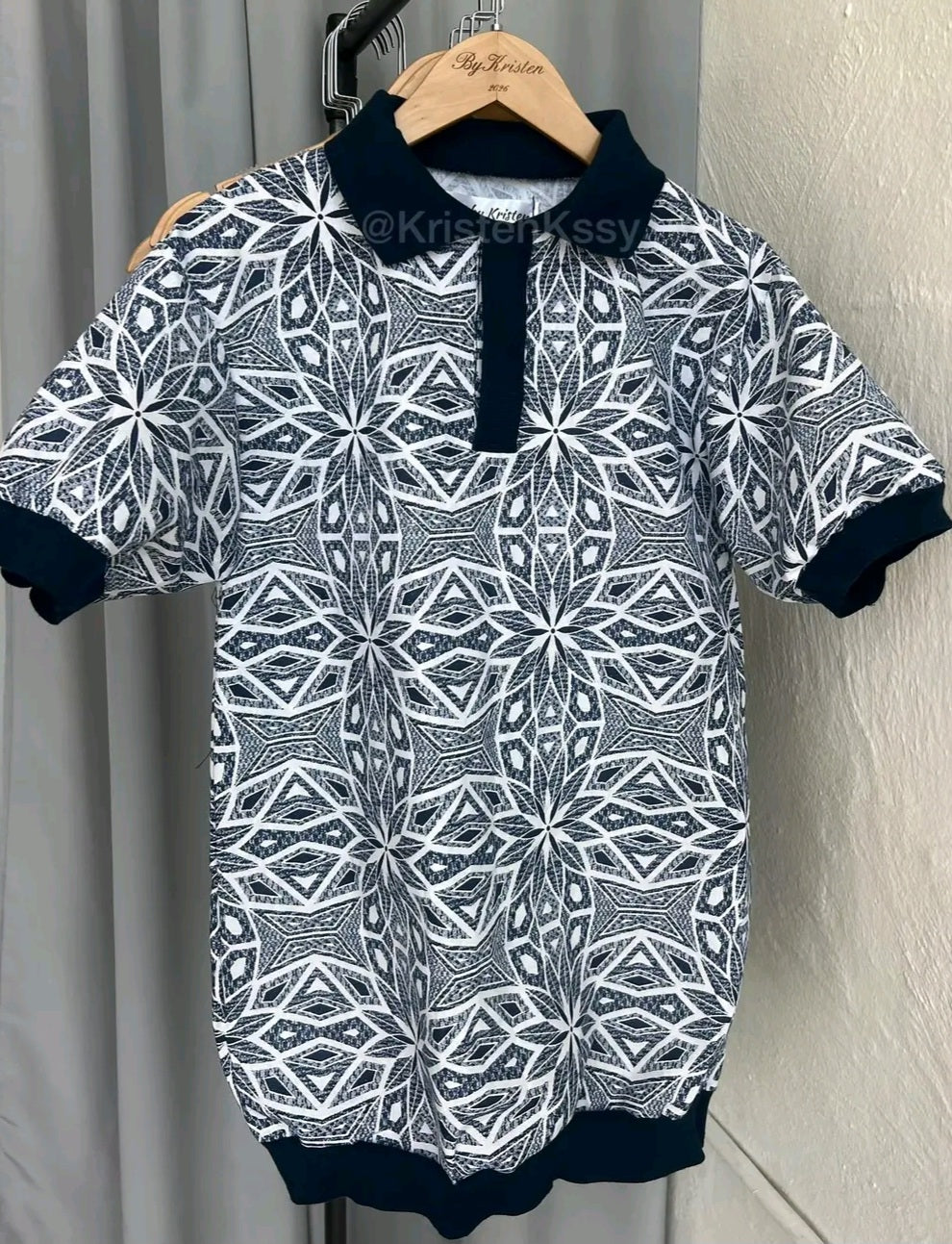 Shweshwe Golf Tshirt in Navy & White Diamond Star print on a hanger